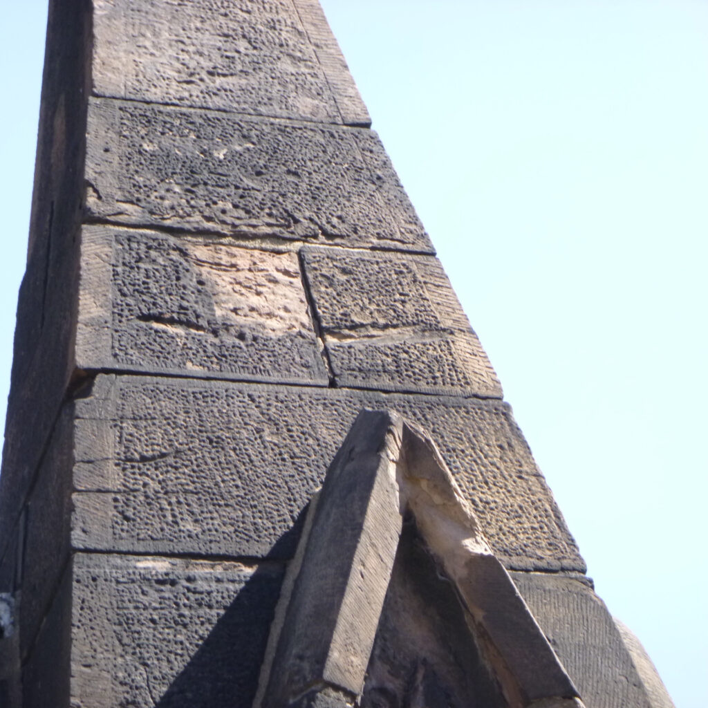 photo of crumbling brownstone on the bell tower