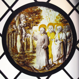 Stained glass image of Jesus and Zacchaeus