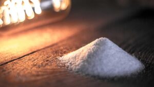 photograph: a mound of salt in candlelight